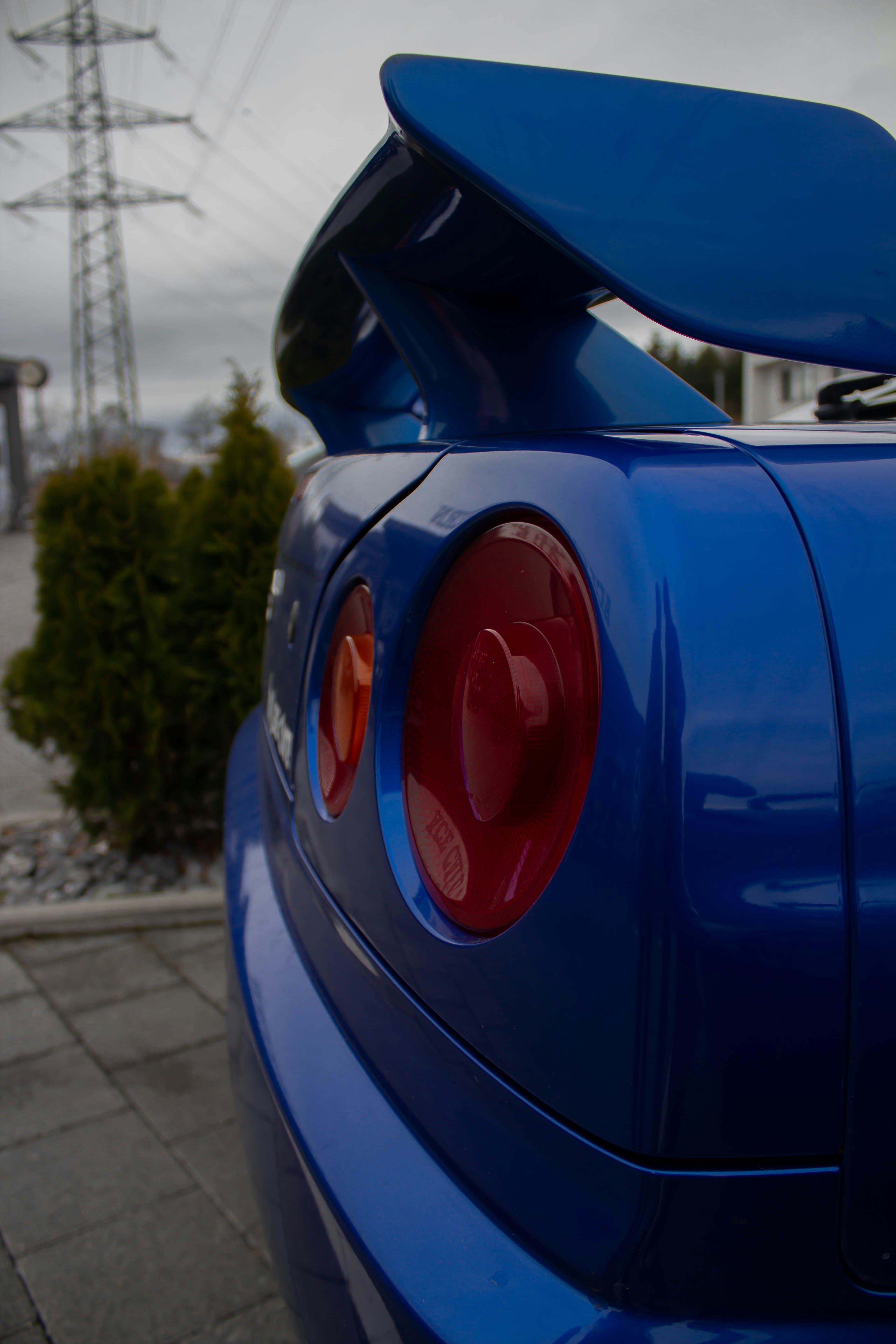 turned-off blue sports car taillights